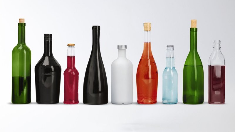 A collection of glass Beverage Bottle options in various shapes and colors.