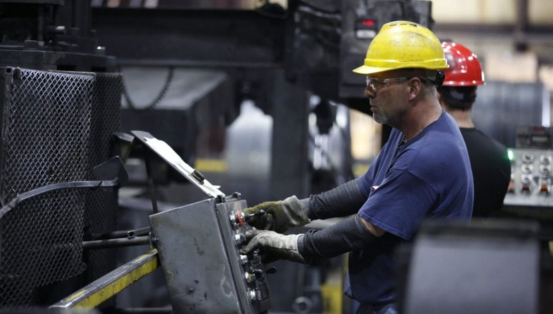 The Future of Automated Structural Steel Fabrication 2 Fabrication operator monitoring steel processing equipment