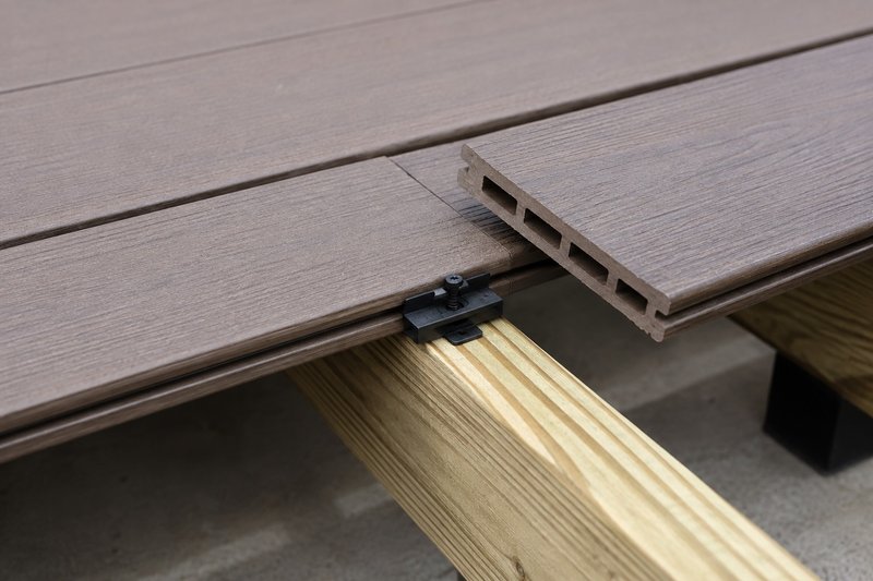 Hidden fastener systems for composite decking boards