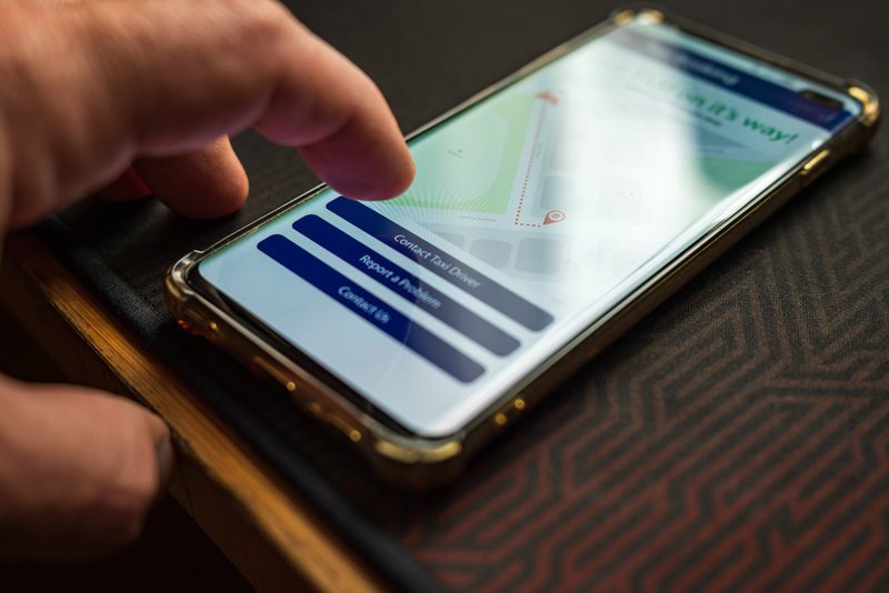 Close up of someone reporting a maintenance issue using a property management app