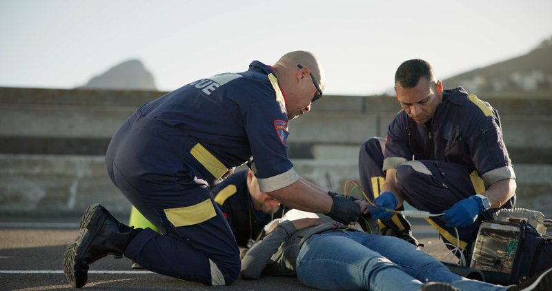 Rescue task force administering first aid to a victim.