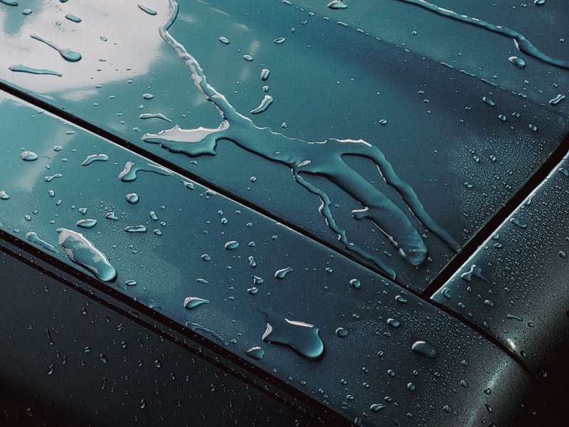 hood of a car fresh out of a car wash station