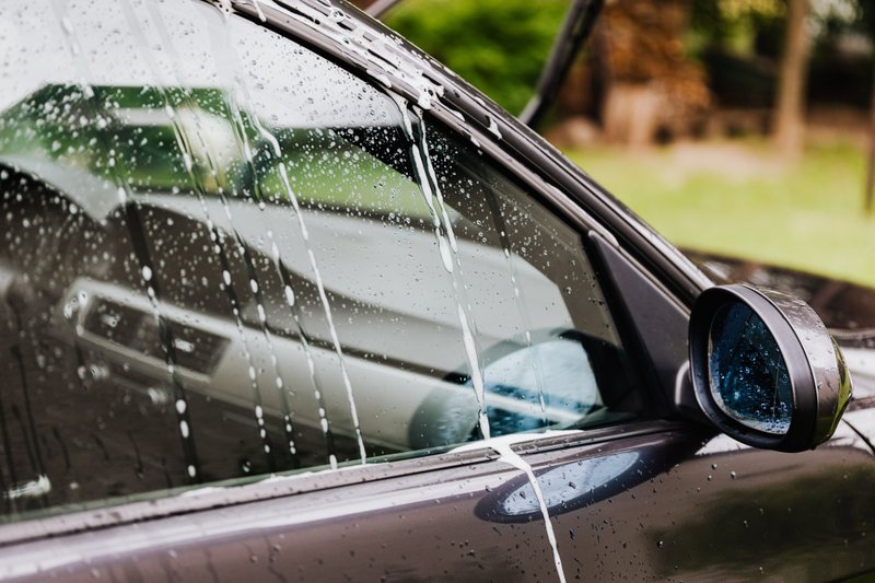 automatic carwash showering a vehicle clean