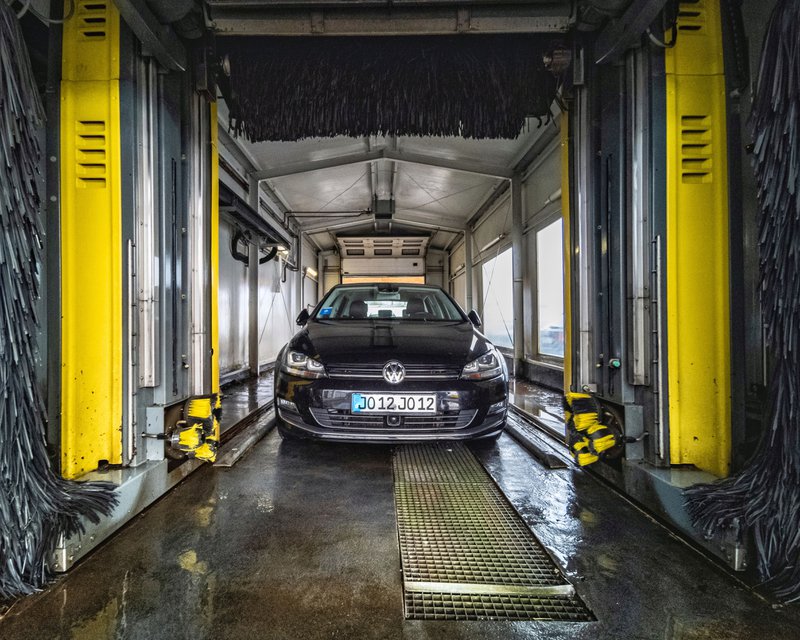 black car inside a car wash tunnel