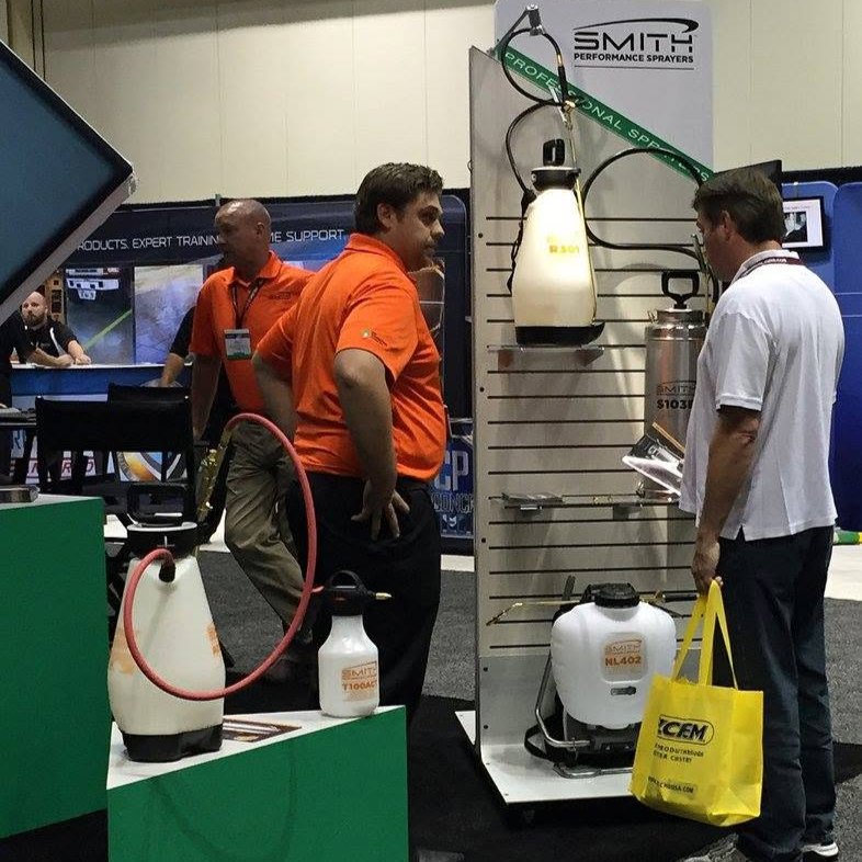 business owner checking professional sprayer 