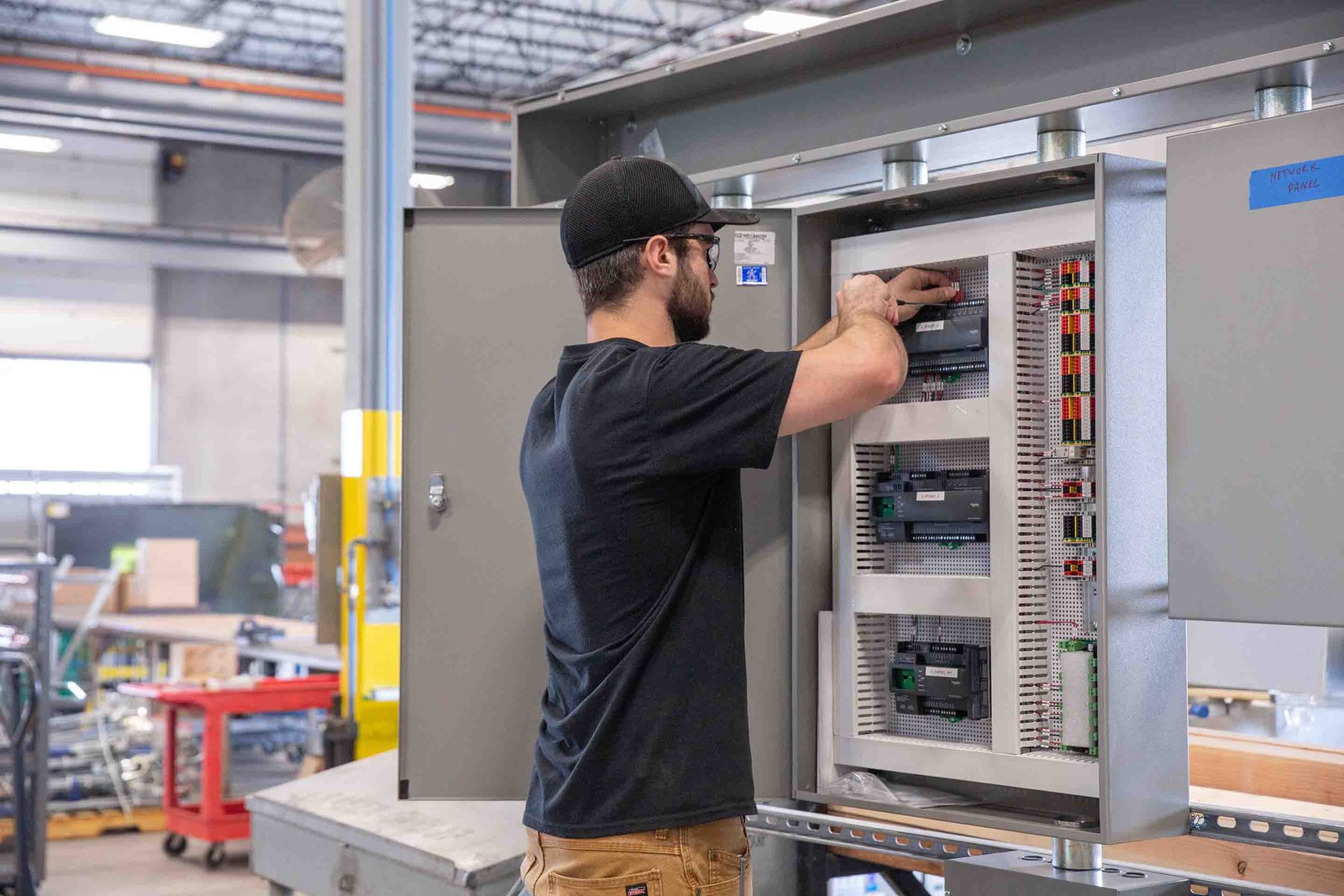 A technician tinkering with building controls.