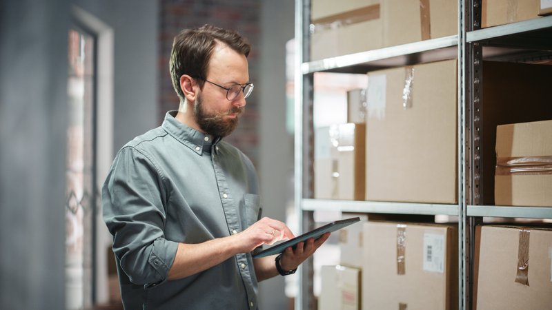 business owner warehouse tablet inventory
