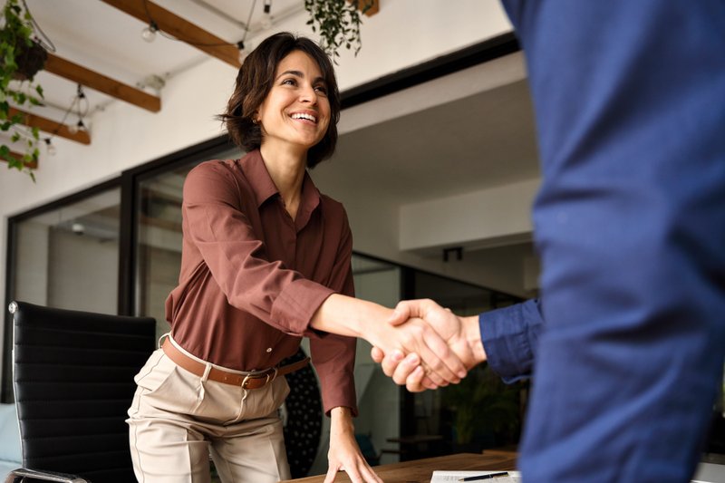 Small business owner meeting with a commercial lender during a traditional bank loan application