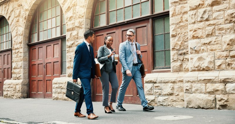 usiness bankruptcy attorney and company representative on the way to attend Chapter 11 court proceedings