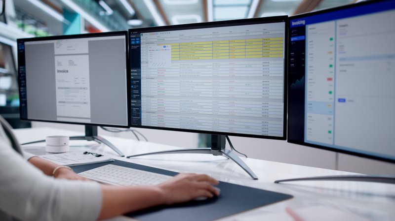 Finance professional processing supplier invoices for business payments