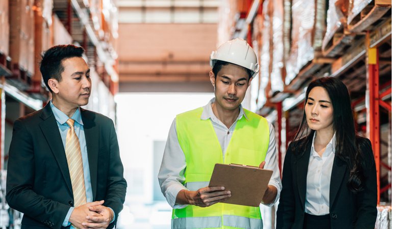 Warehouse supervisor managing daily operations while waiting for customer invoice payments.