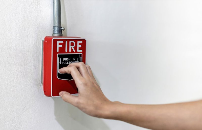 pulling down fire alarm for testing regulations