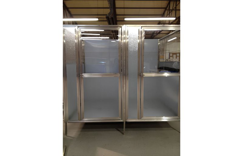 luxury glass kennels at a boarding facility