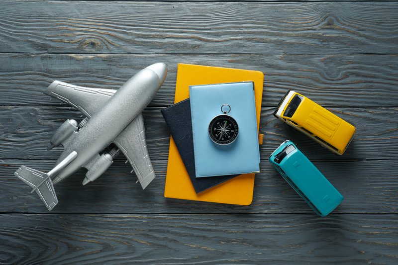 Traveling, adventure and vacation concept with compass
