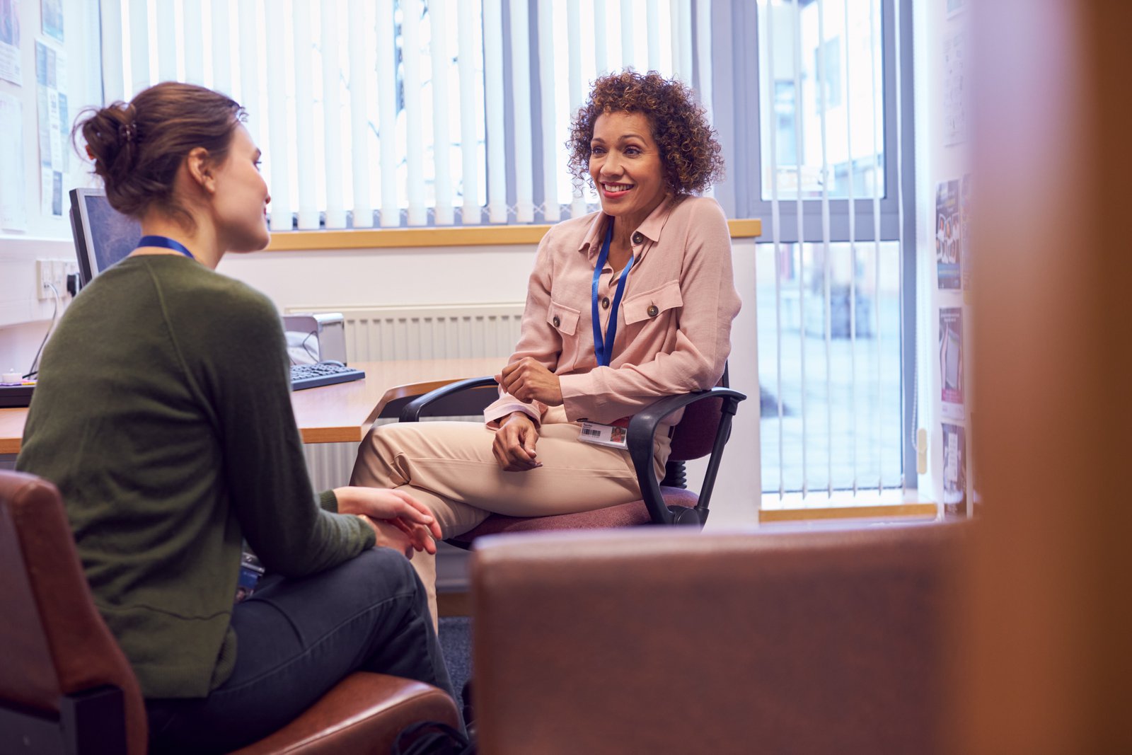 University counselor meeting with a student as part of an early support and prevention plan