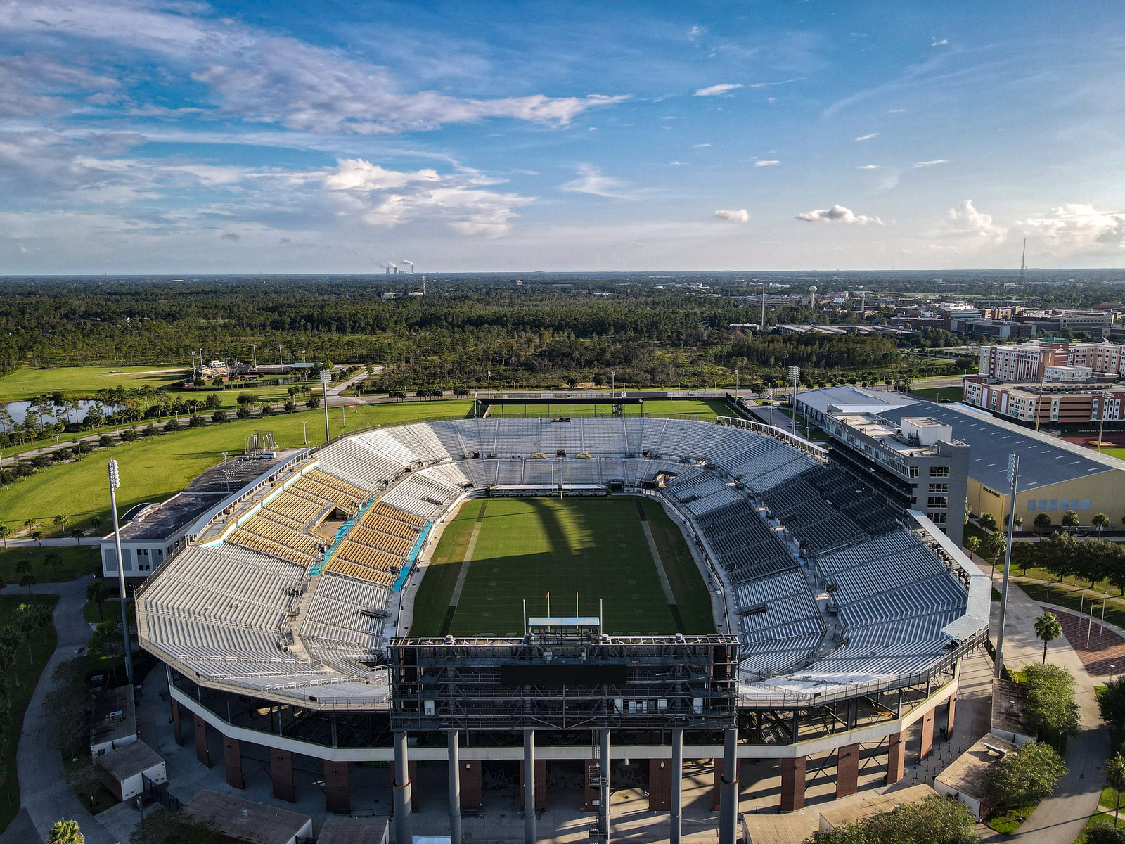 Aerial view of a college football stadium on a university campus, where game day safety plans follow the national incident management system