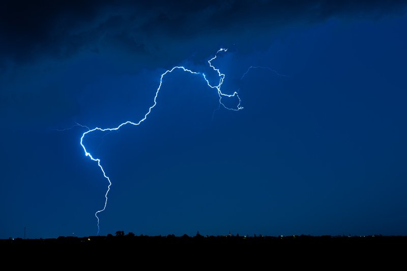 Bolt from the blue showing lightning strike distance beyond a thunderstorm