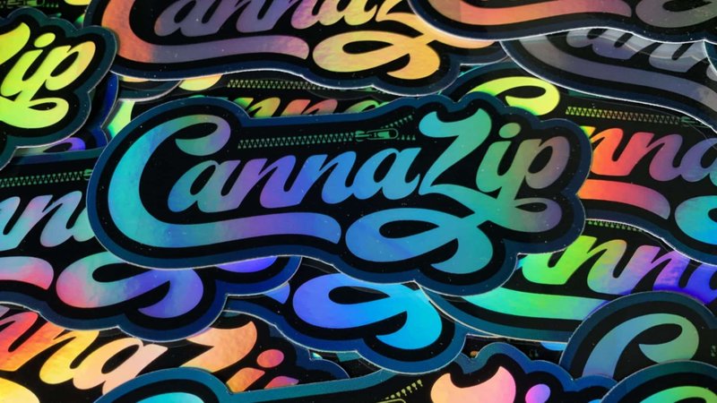 Holographic die-cut CannaZip labels showing packaging vendor consolidation for stickers, labels, and branded components