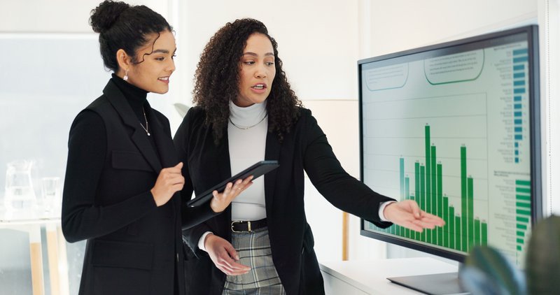 Business women, teamwork and computer screen for data analysis, digital marketing research and social media report. Professional analyst, manager and clients with graphs, statistics and tablet review.