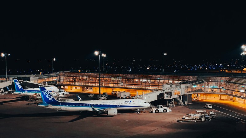 a large jetliner sitting on top of an airport tarmac