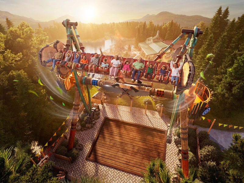parc d'attractions avec une balançoire géante dans les airs.