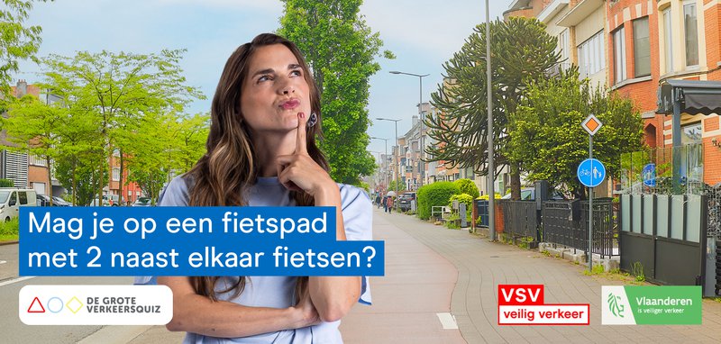 Vrouw in een straat met een dubbel fietspad. Grote Verkeersquiz